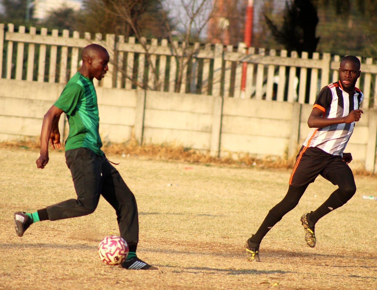 Match at stadium between green and blue teams